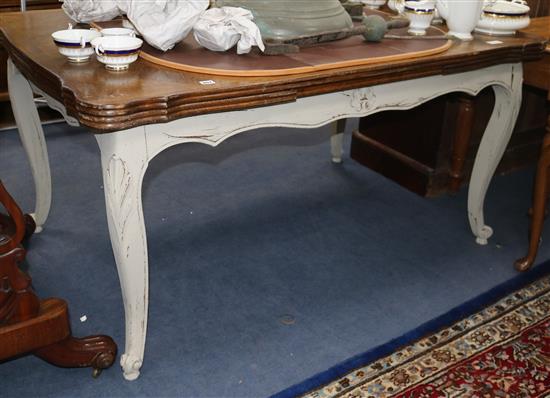 A painted French Louis XV draw leaf dining table W.150cm